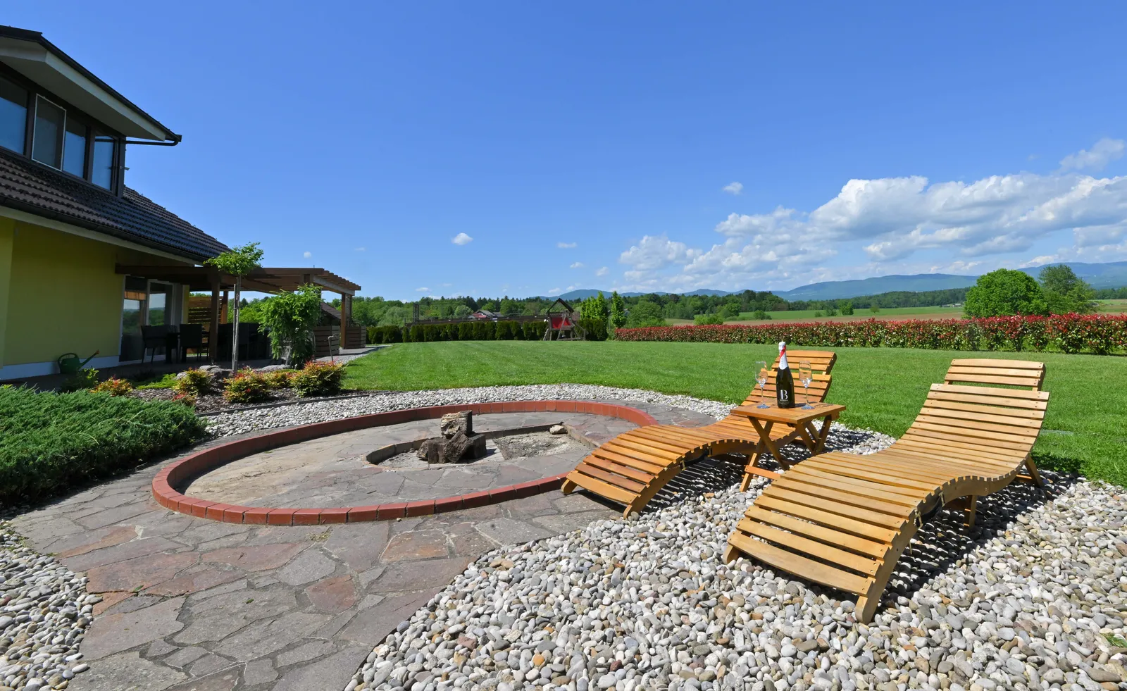 Sun loungers and a fire pit in the garden